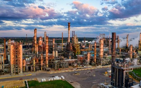 Stunning aerial shot of an oil refinery in Rosemount, MN, showcasing industrial complexity at sunset.