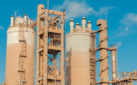 A view of urea towers at an industrial plant in Libya, captured on a clear day.