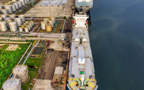 Aerial shot of oil tankers and storage facility in North Jakarta, Indonesia.