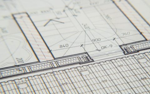 Close-up of an architectural blueprint showcasing intricate design details for a building layout.