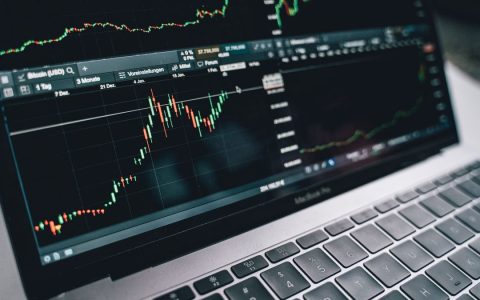 Close-up of a financial graph on a laptop screen, depicting stock market analysis in Berlin.
