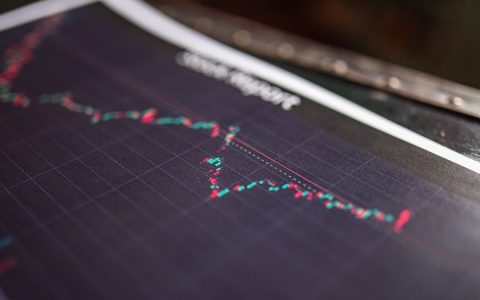 Close-up of a stock report showing a financial data graph.