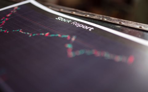 Detailed stock report showing market trends on paper charts.