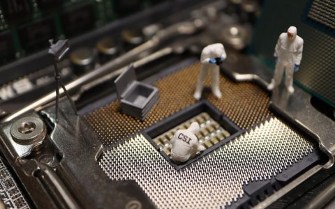 Tiny CSI figures conduct an investigation on a CPU, blending technology with creativity.