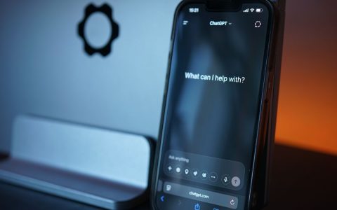 Close-up of a smartphone with AI chat interface, showcasing advanced technology in a sleek design.