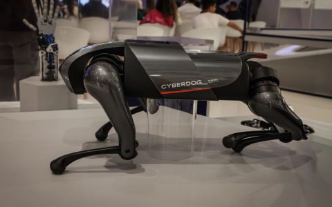 A futuristic robot dog, the Cyberdog, on display in an indoor setting, showcasing advanced robotics technology.