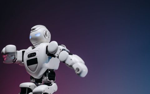 Close-up of a futuristic robotic toy against a gradient background, symbolizing innovation and technology.