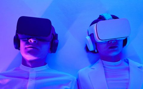 Two people immersed in VR, highlighting future technology and virtual engagement.