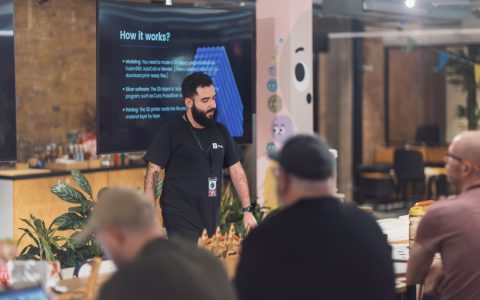 Professional presentation in a modern office setting focused on team collaboration and engagement.
