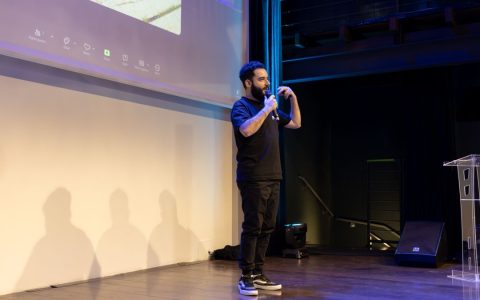 Energetic speaker delivering a talk at a corporate event